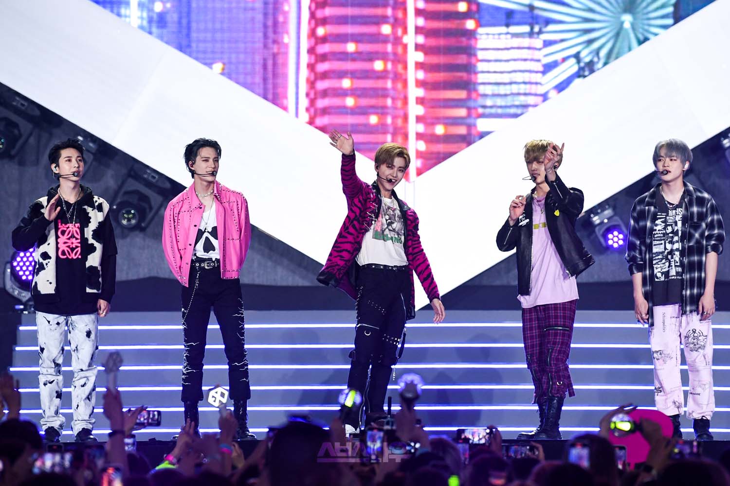 Streetside billboard with flyposters of the Batch.Works brand and illustrations