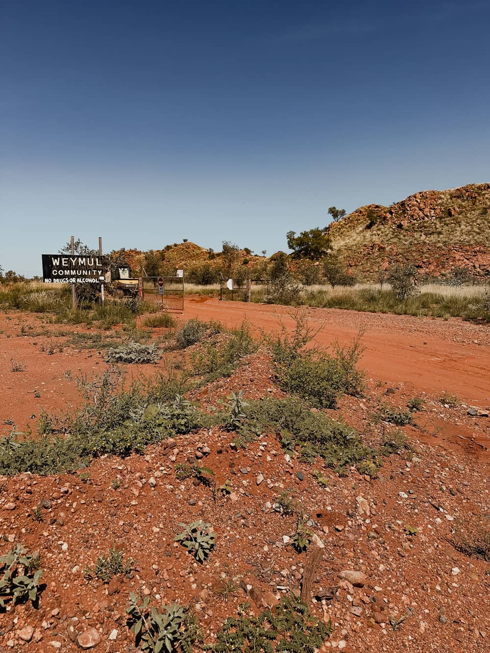 Weymul Community entrance and a gate in a remote Australian landscape
