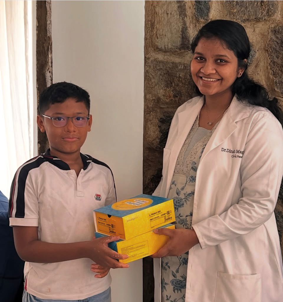 girl wearing black vest raising two hands near green grass field during daytime