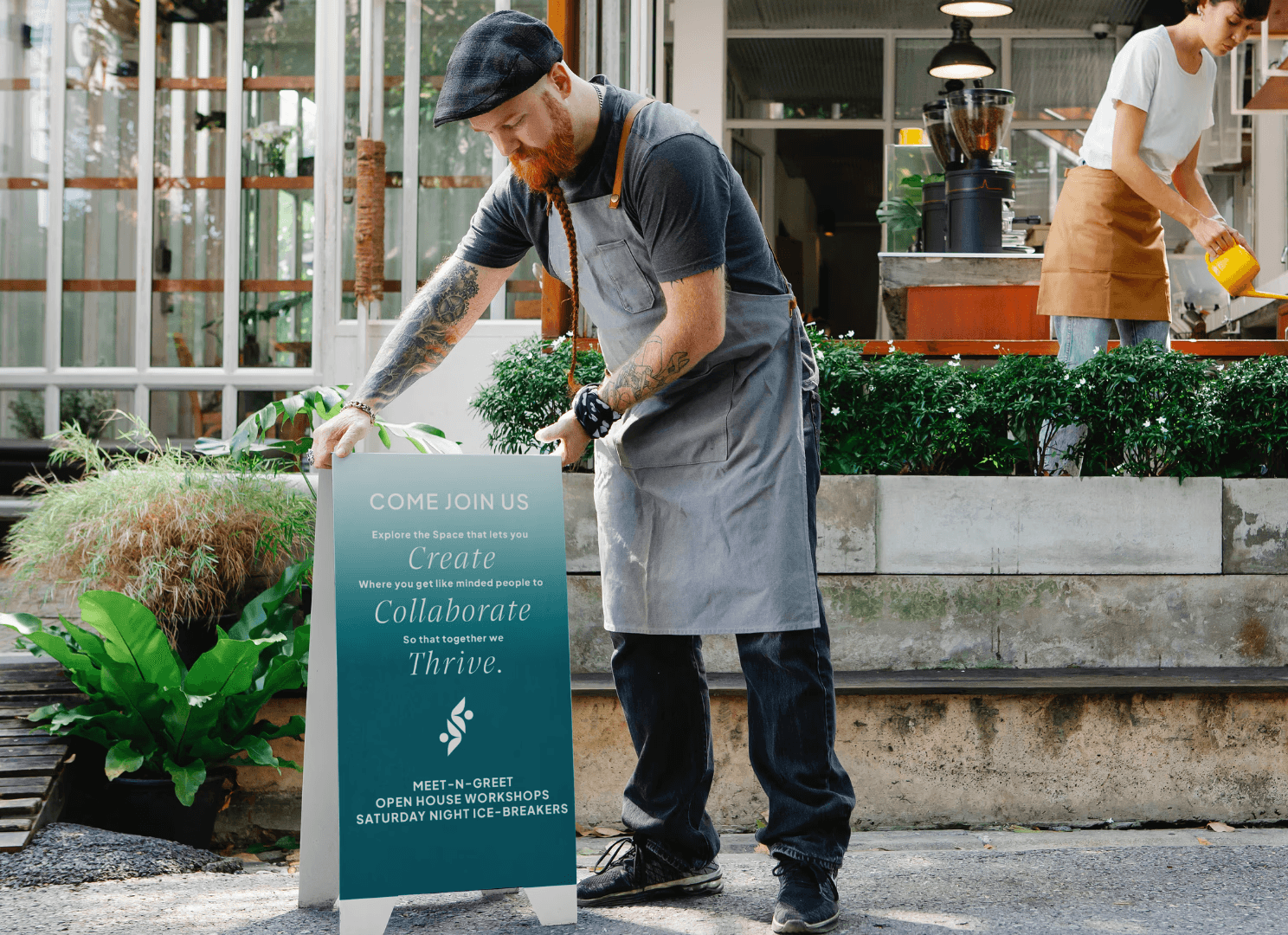 Man putting a cafe signage