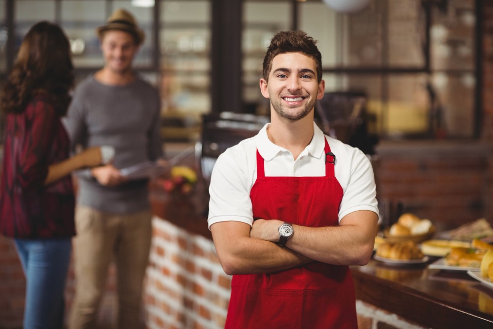 restaurant-waiter-with-arms-crossed-best-table-reservation-software