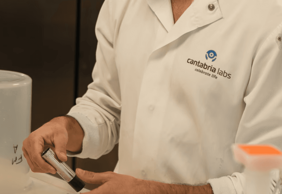 Lab technician kept a small chemical bottle in a stand