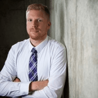 man wearing blue and red collared shirt