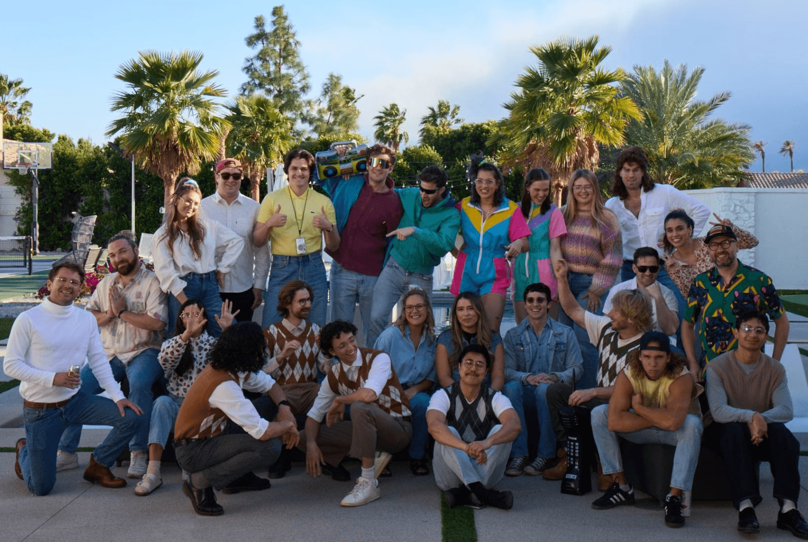 Black and white portrait of a smiling person with curly hair