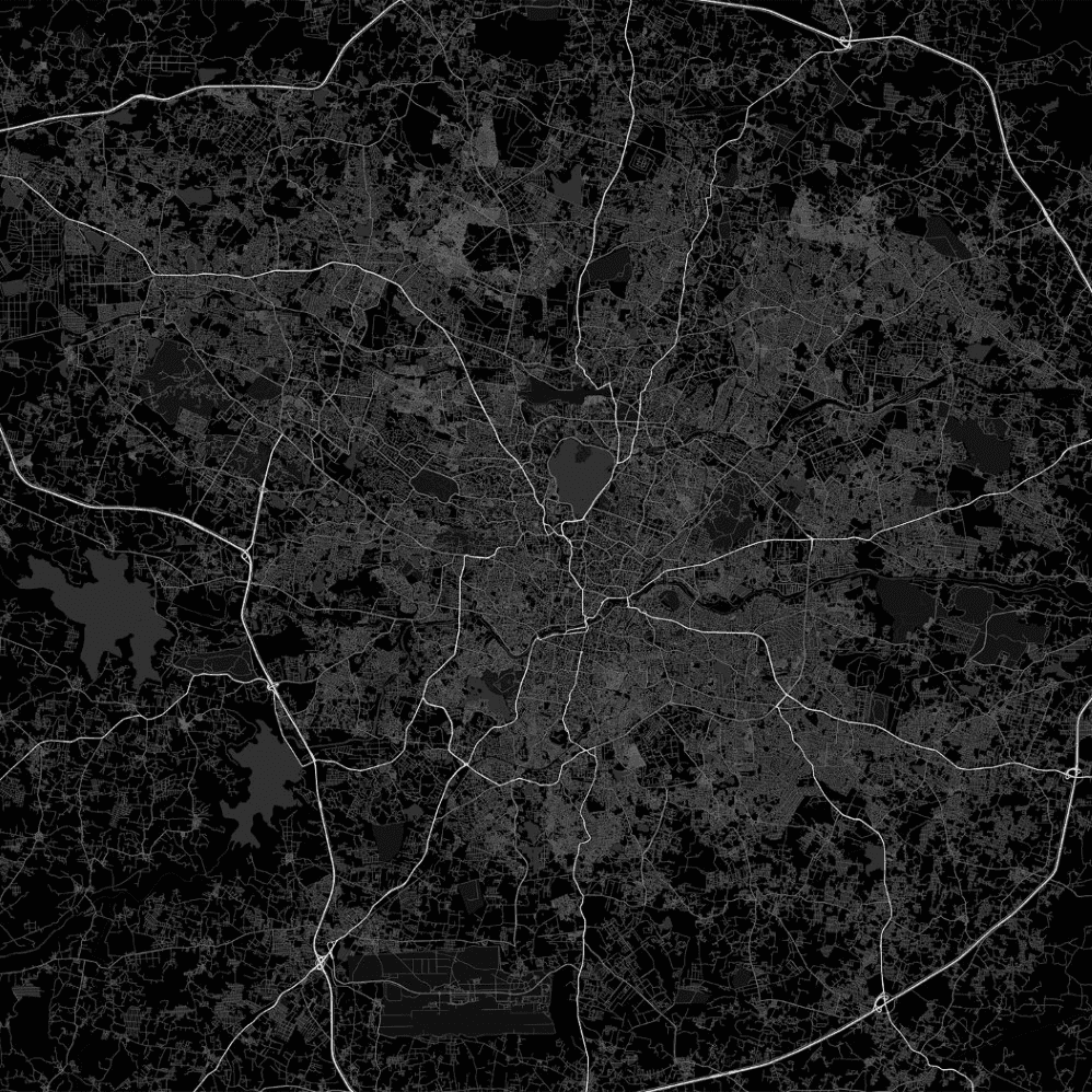 A group of four people engaged in a discussion while seated in a cozy, plant-filled setting.