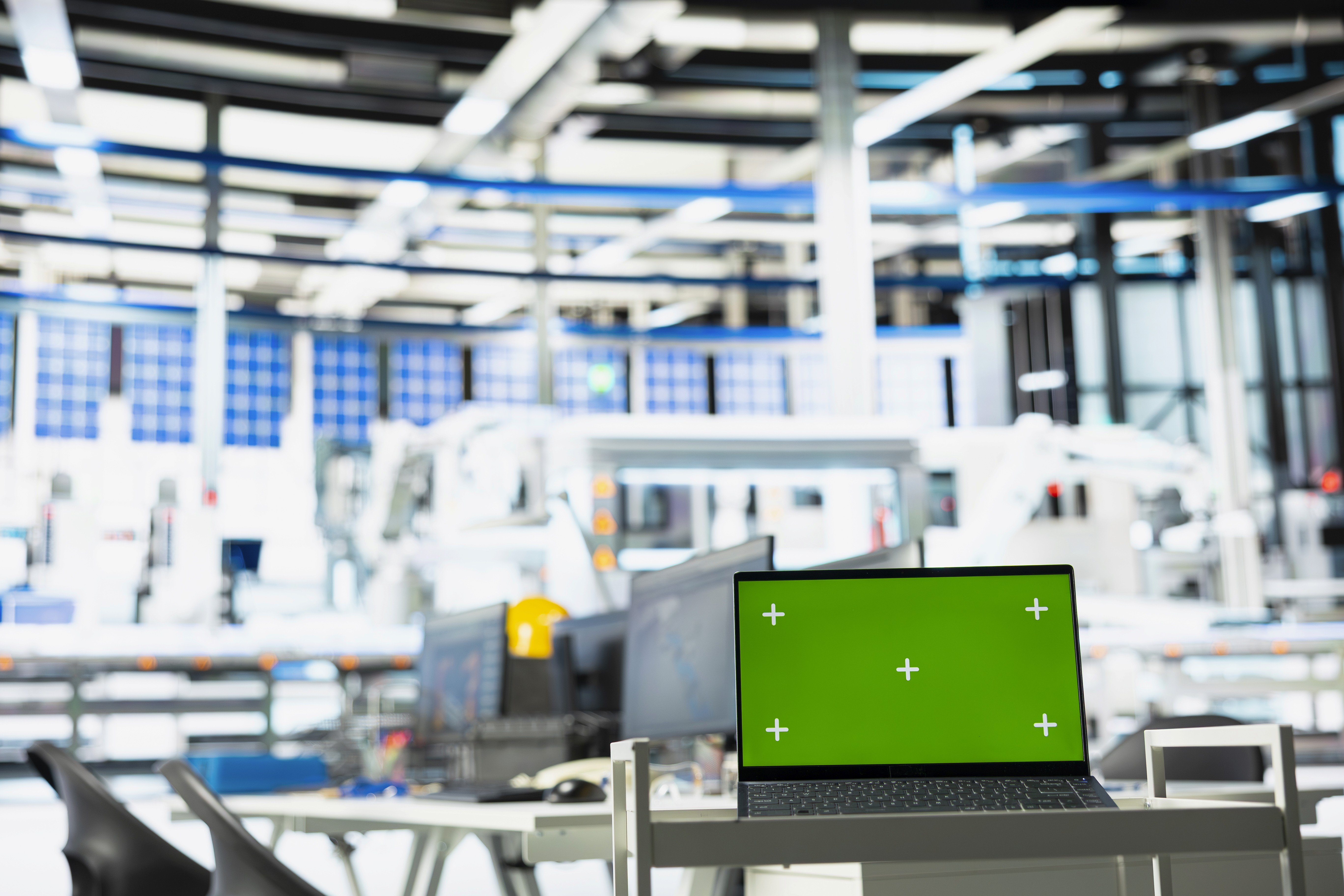 Man in suit smiling in a lit hallway