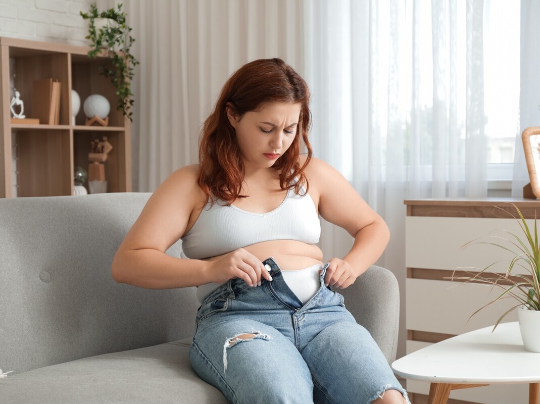 woman feeling sad after experiencing weight gain from birth control