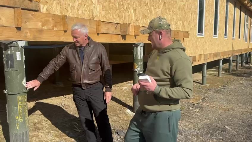 Commander Ehr inspecting site with local commander