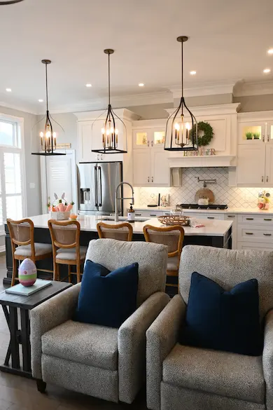 A white ceiling light fixture with a brass trim.