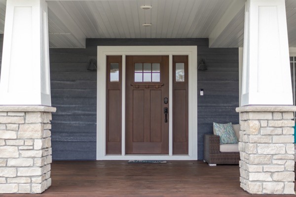 Dark walnut porch front door white columns