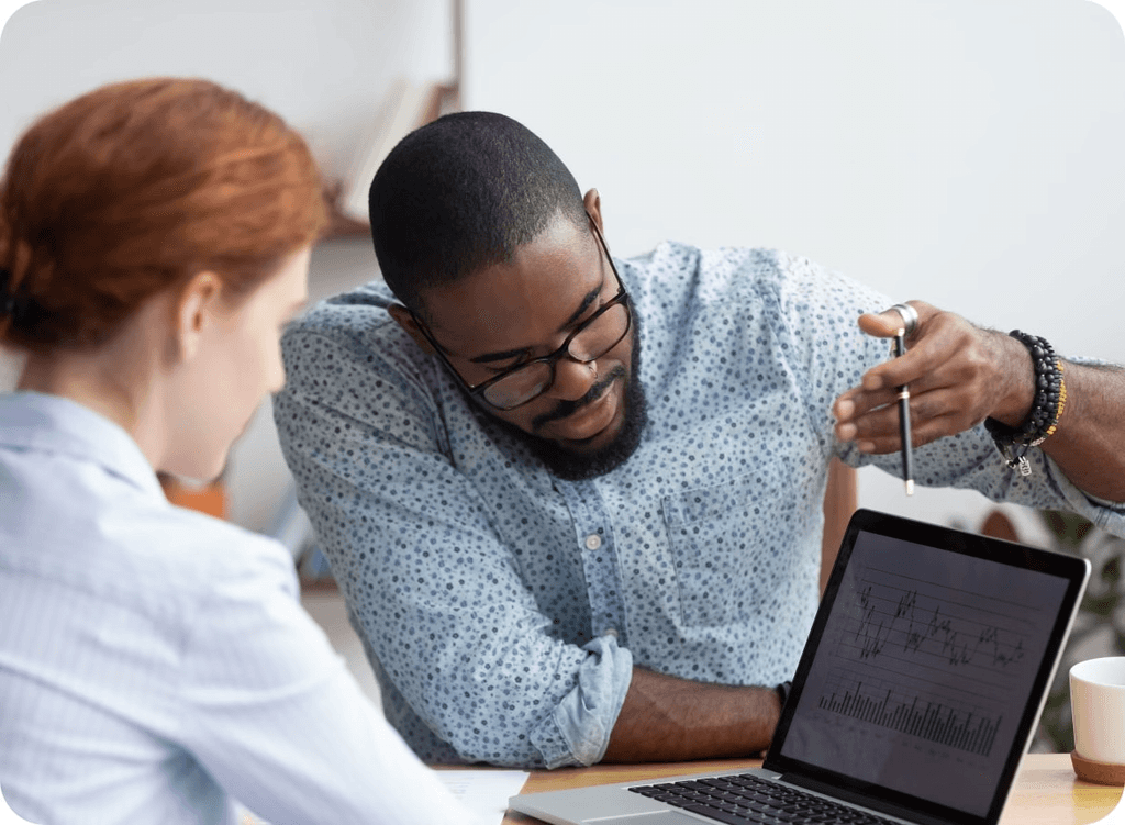 a man and a woman with a laptop in a meeting