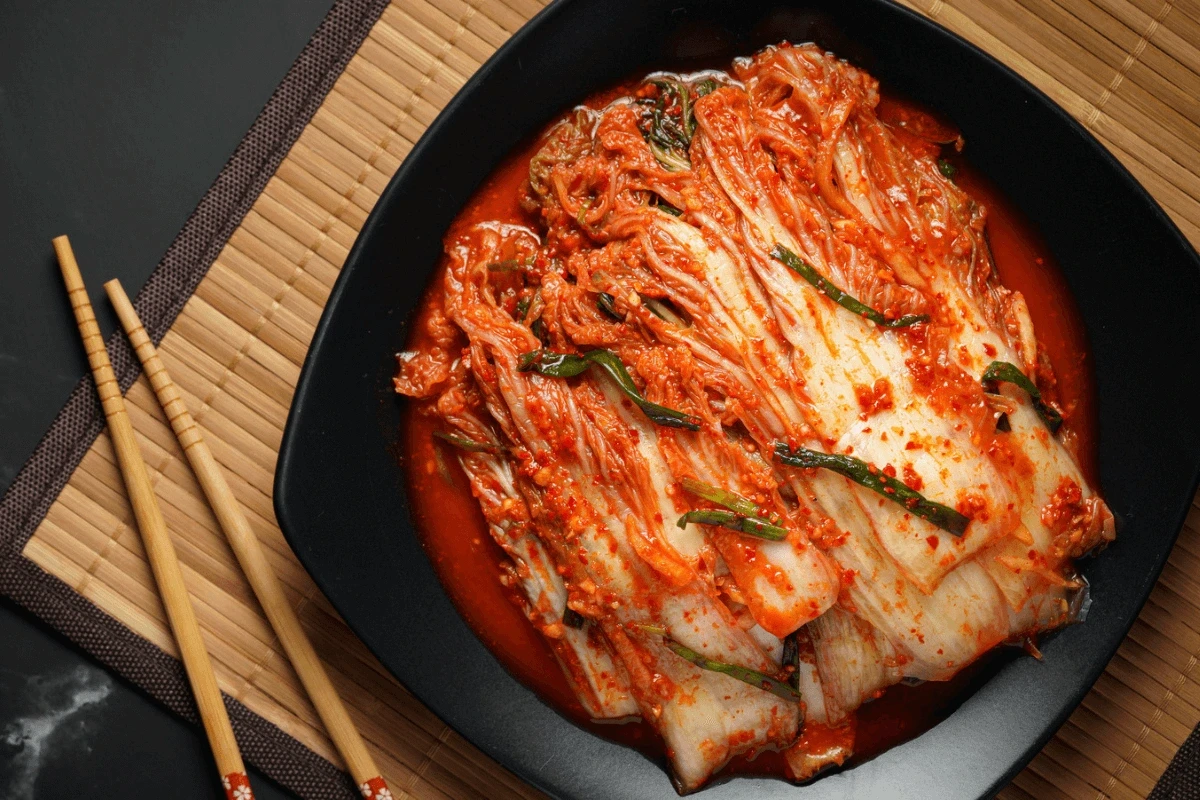 Spicy kimchi in black bowl