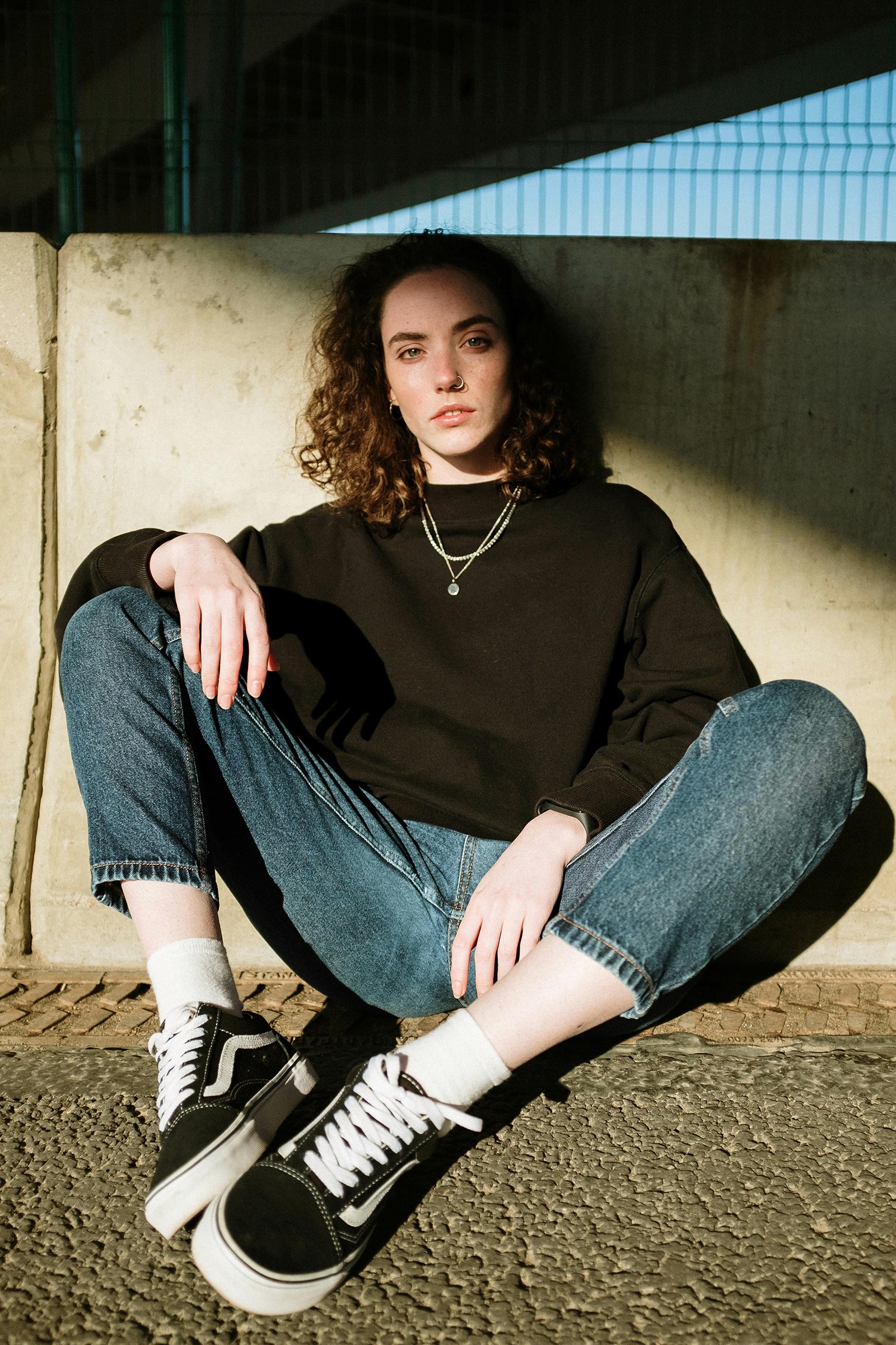 Beautiful girl sitting on the road