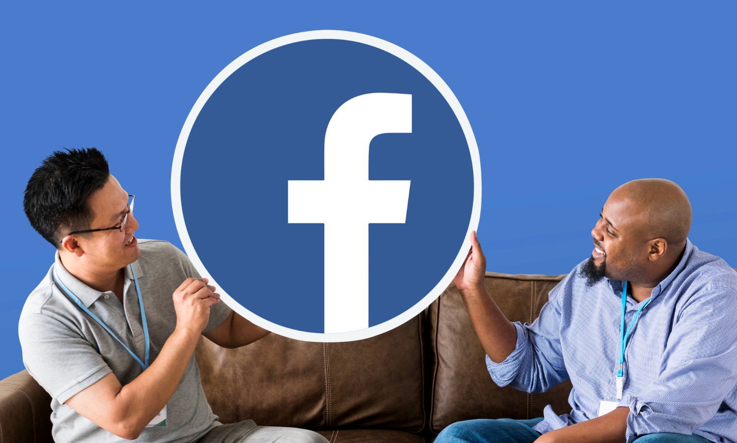 Two men seated on a couch, engaging in conversation, with a Facebook logo prominently displayed nearby.