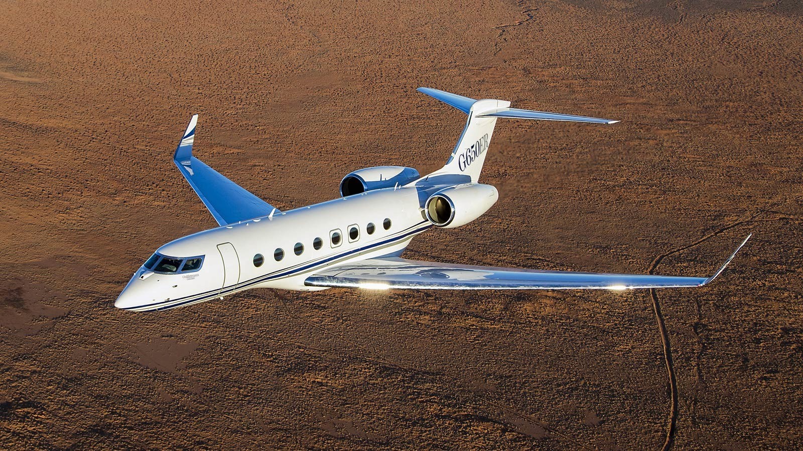 The Gulfstream G650ER is an ultra-long-range business jet manufactured by Gulfstream Aerospace.      It has a range of up to 7,500 nautical miles and can accommodate up to 19 passengers.      The G650ER is an improved version of the G650, with an increased range and improved avionics.      It is powered by two Rolls-Royce BR725 engines and has a top speed of Mach 0.925. The cabin is designed for comfort and productivity, with customizable seating arrangements and advanced connectivity options.      The G650ER is widely used by businesses, governments, and private individuals for long-distance travel.   