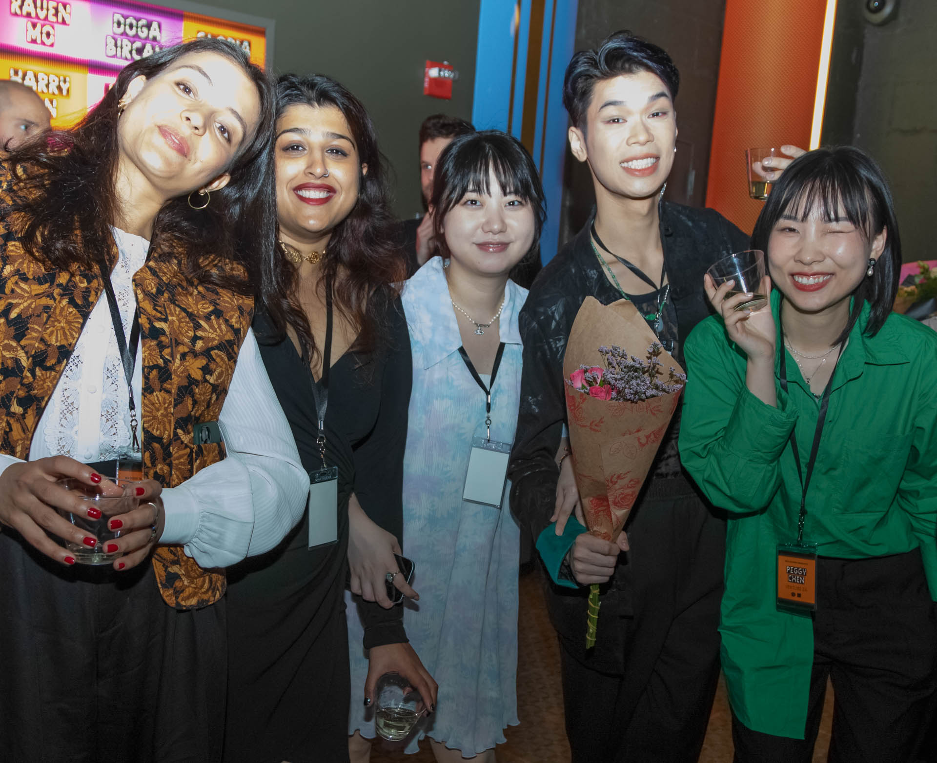 a group of students smiling for the camera in the SVA Theatre lobby after the Venture Forum
