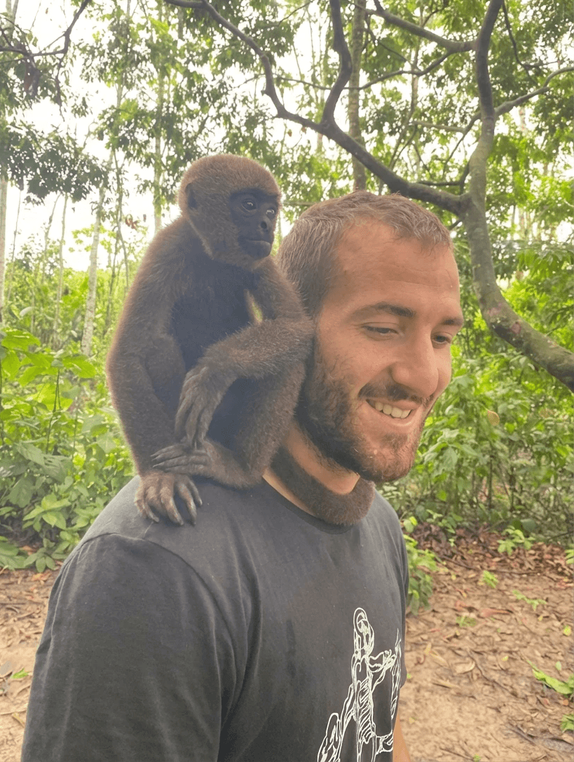 man with glasses smiling fully