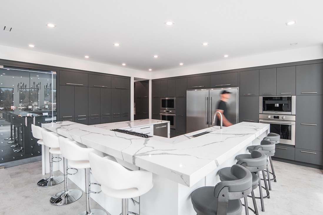 Contemporary kitchen with island and full-height cabinets
