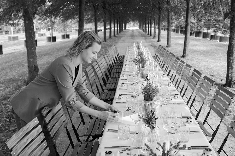 man wearing gray polo shirt beside dry-erase board