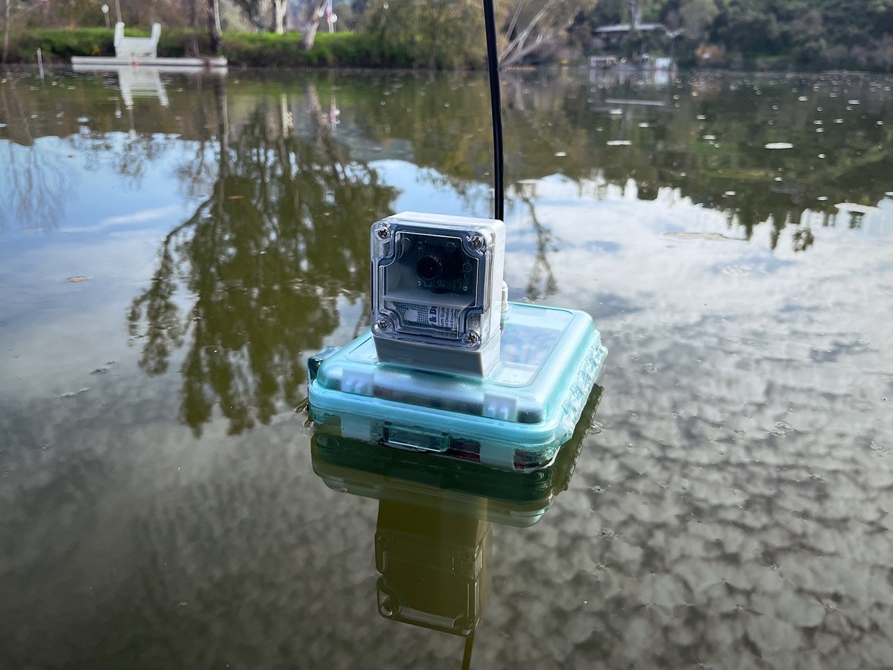 red and white lighthouse on brown rock formation in the middle of sea during daytime