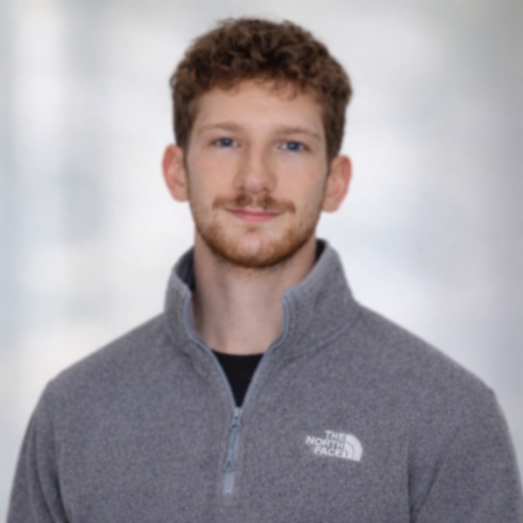 a woman with long blonde hair wearing a black shirt