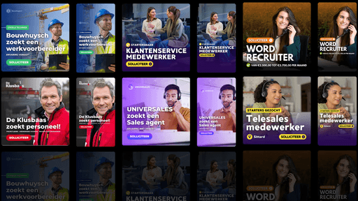 A talent recruiter with a soft smile working on her laptop in the office. The angle is on her face so we can't see what's is on the screen. She is wearing a blazer 