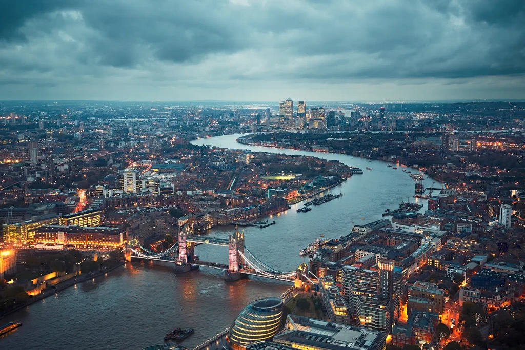Aerial view of illuminated London cityscape, the city of contemporary fashion apartments.