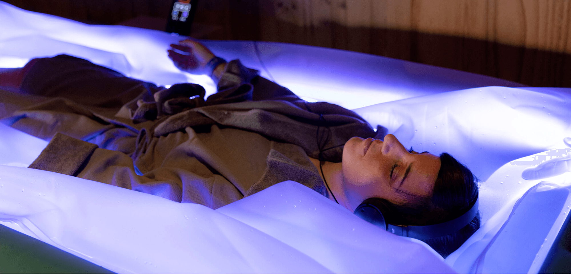 A piece of ice sitting on top of a sandy beach