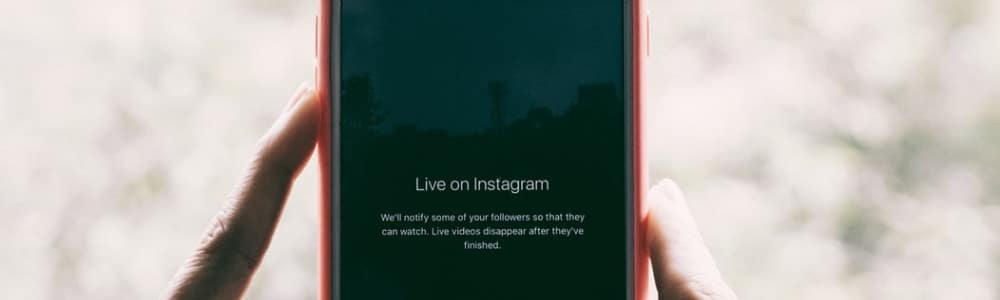 phone screen that reads 'live on instagram'