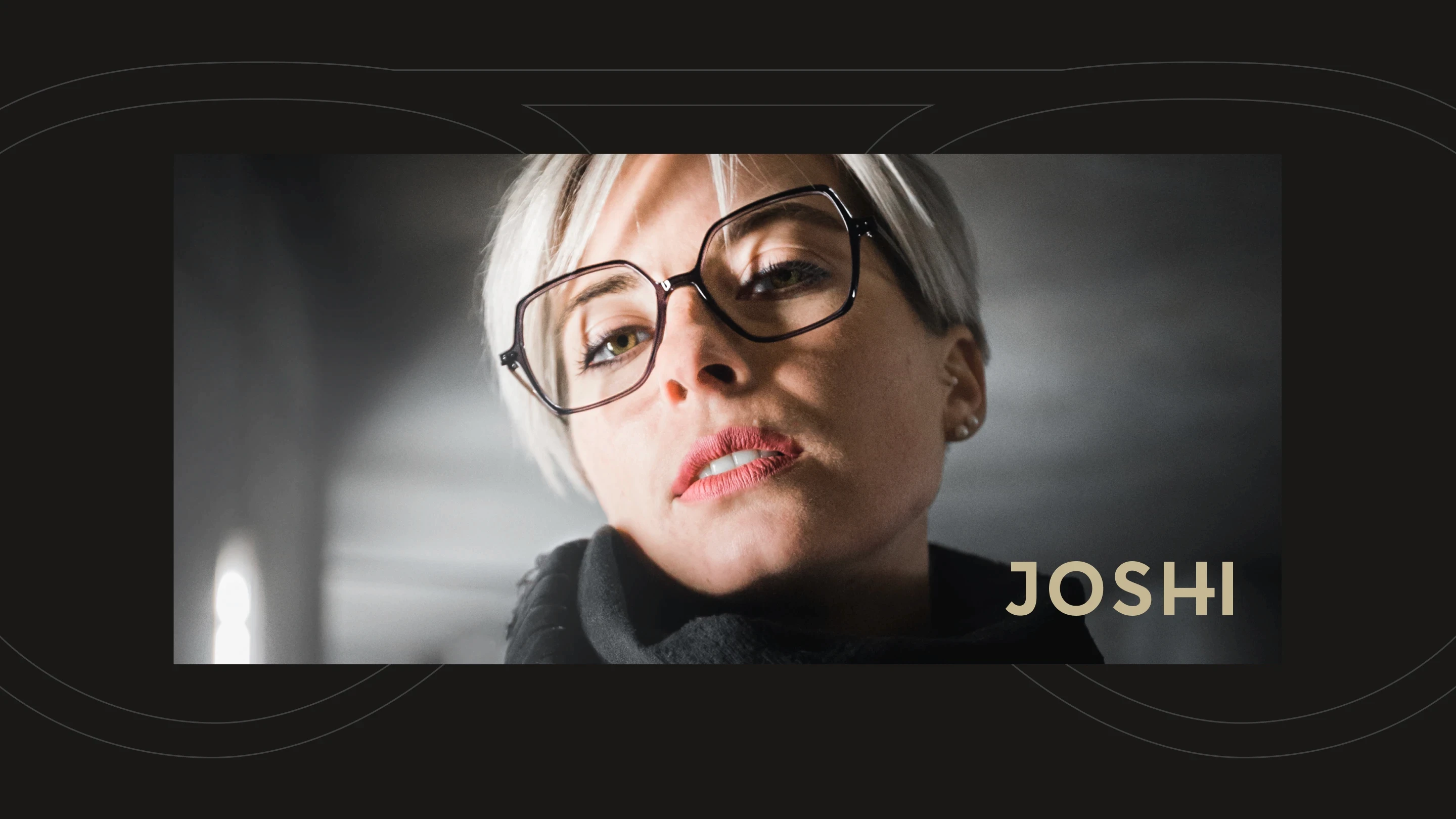 Woman wearing glasses  looking down into camera