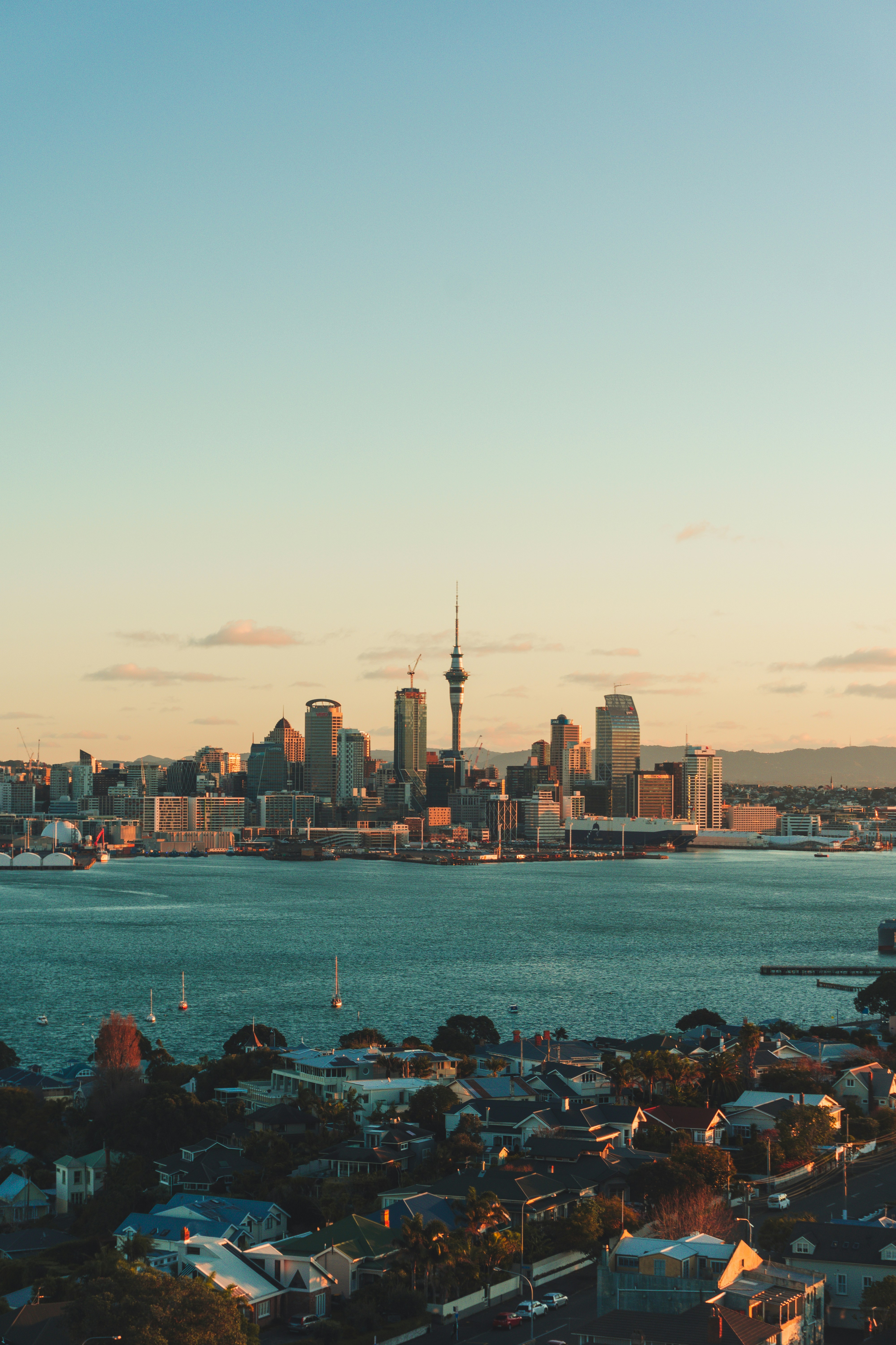 city skyline across body of water during daytime