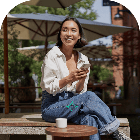 Young woman on her phone using the Chest pension app