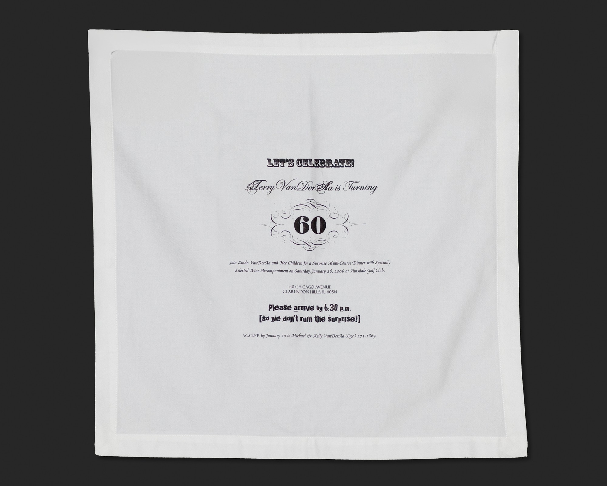 Suprise birthday party invitation screenprinted on a white linen napkin.