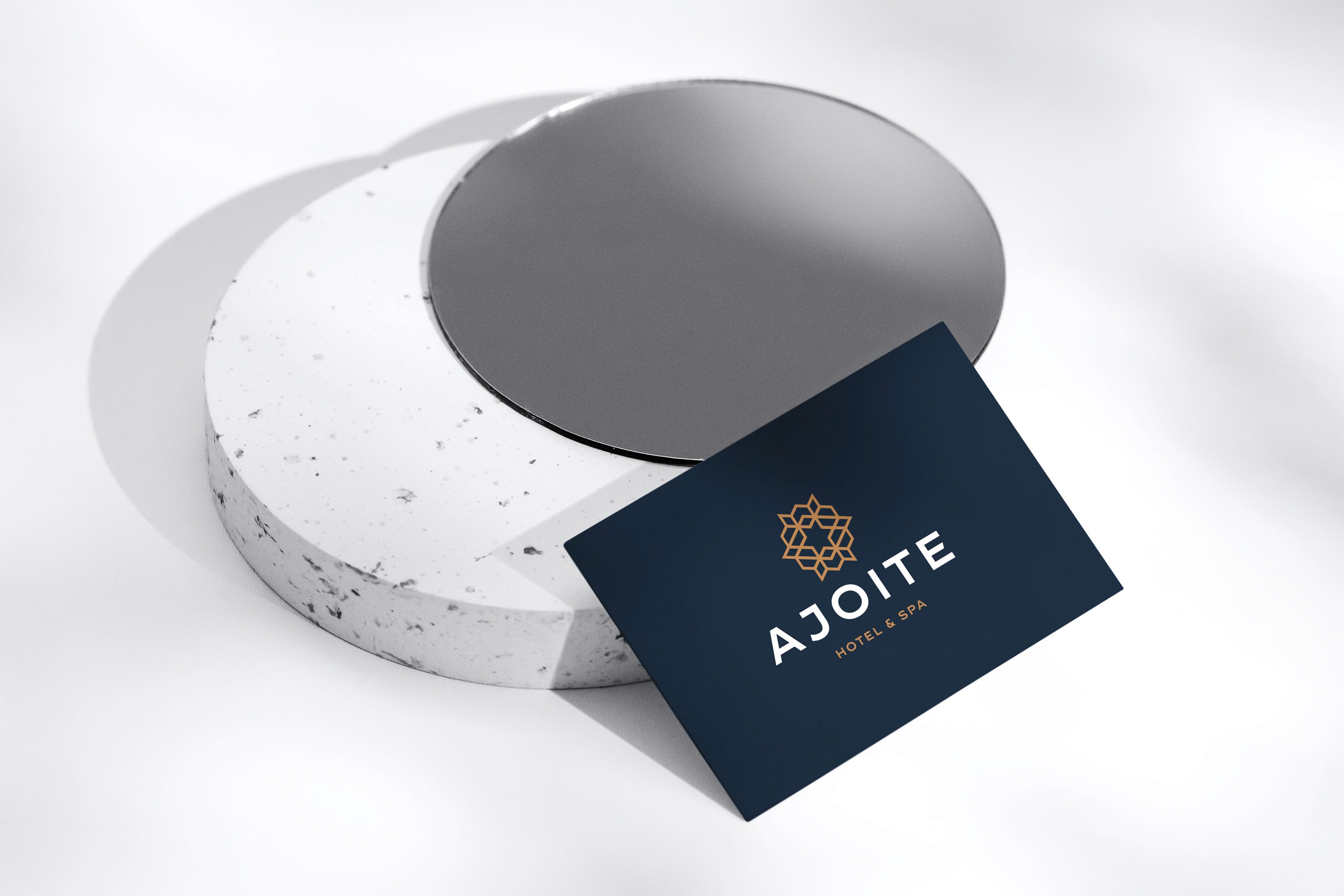 Black cosmetic jar on dark stone surface