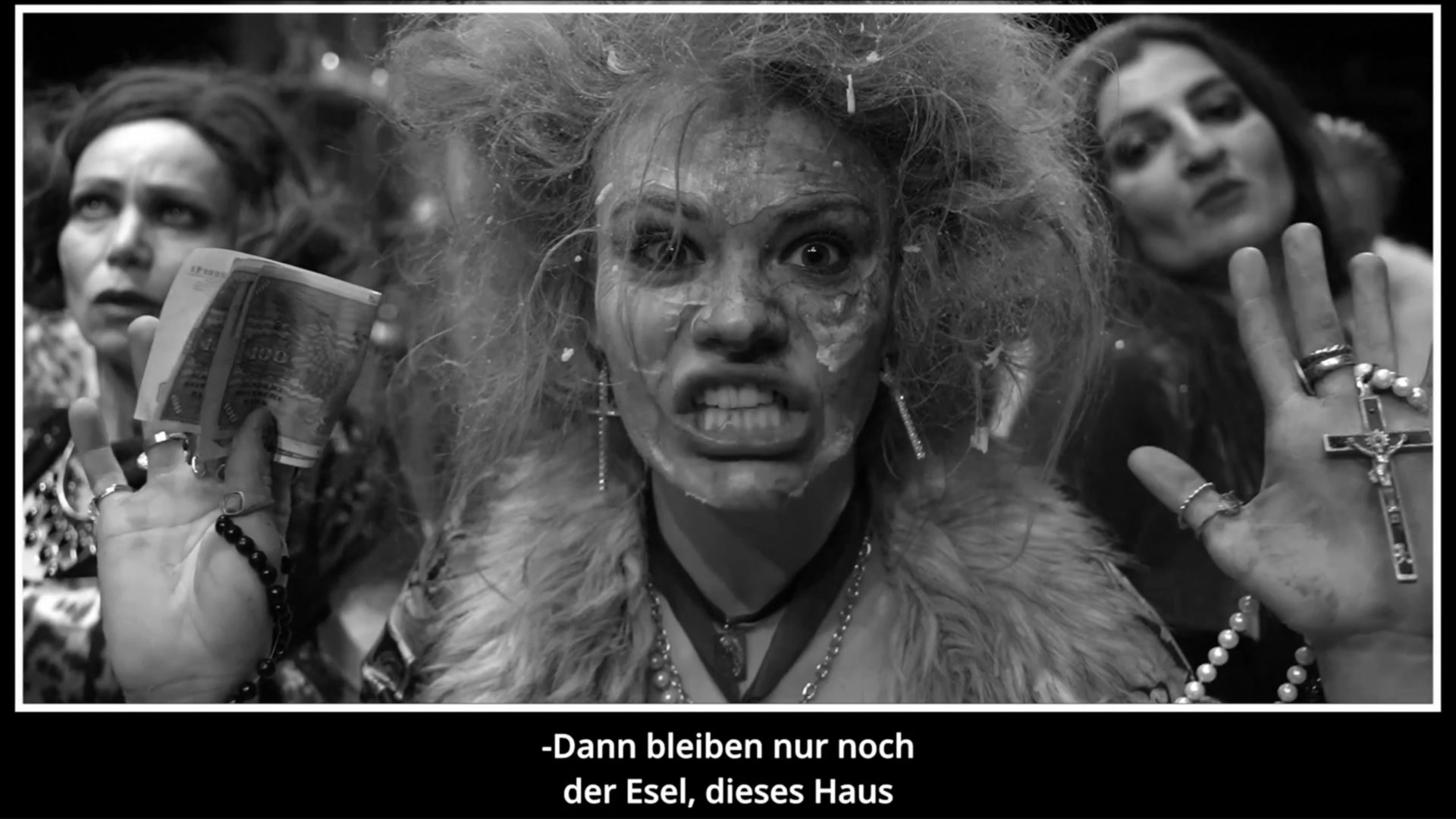 A green butterfly rests on a flower.