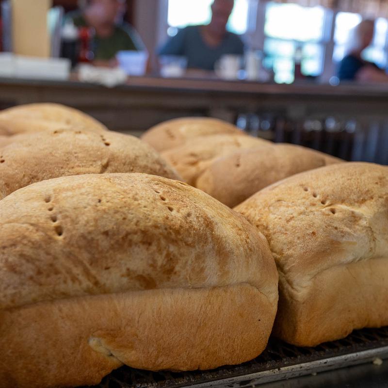 Fresh baked bread cooling on a tray inside Duncan's Dairy Bar.