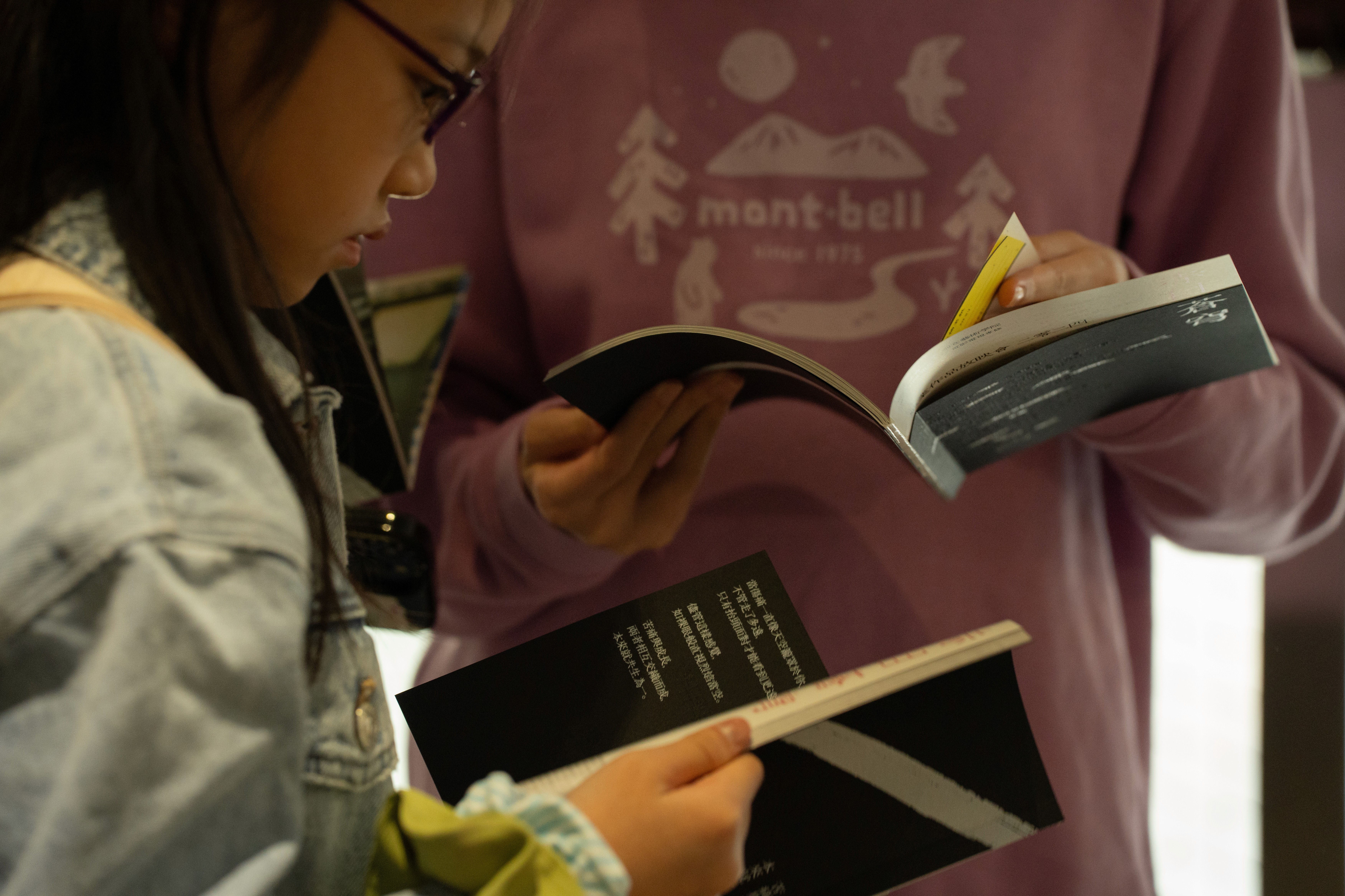audience reading the festival program