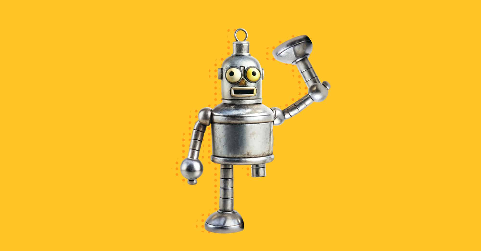 Robot de metal levantando un accesorio sobre fondo amarillo.