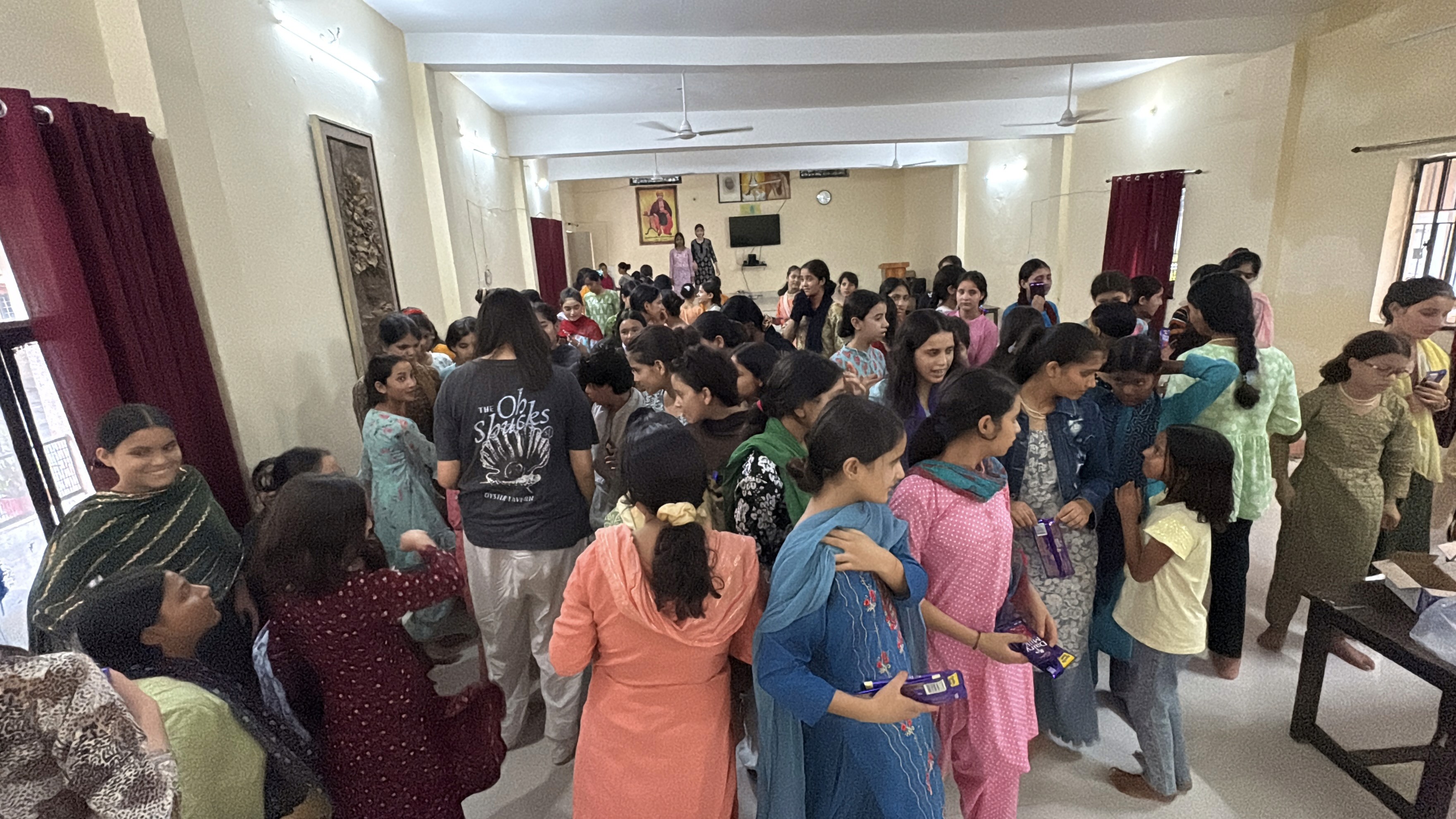 person sitting on grass and using phone