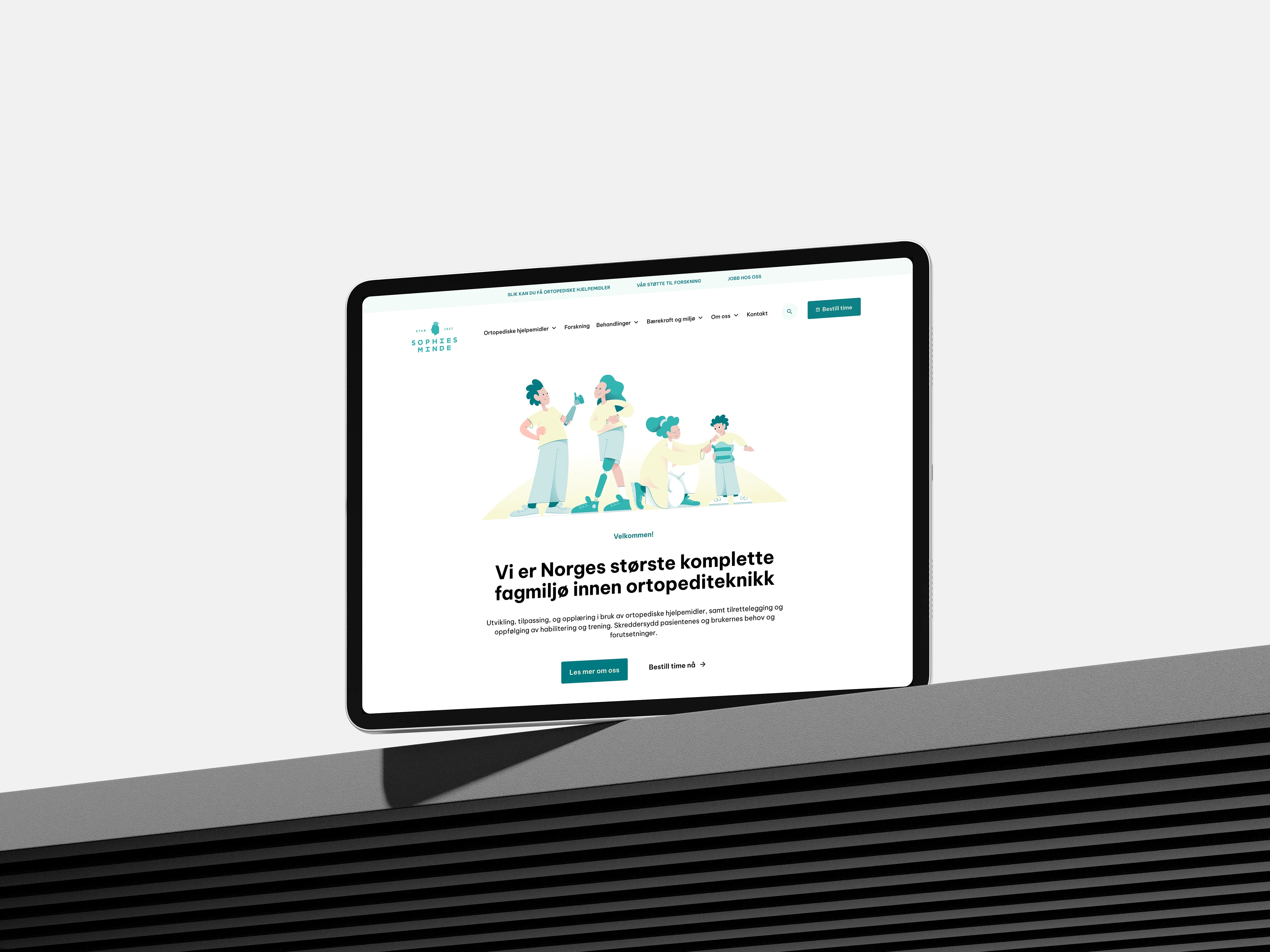 Website homepage on a tablet showcasing a family illustration and medical text.