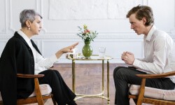 A therapist talking to a man