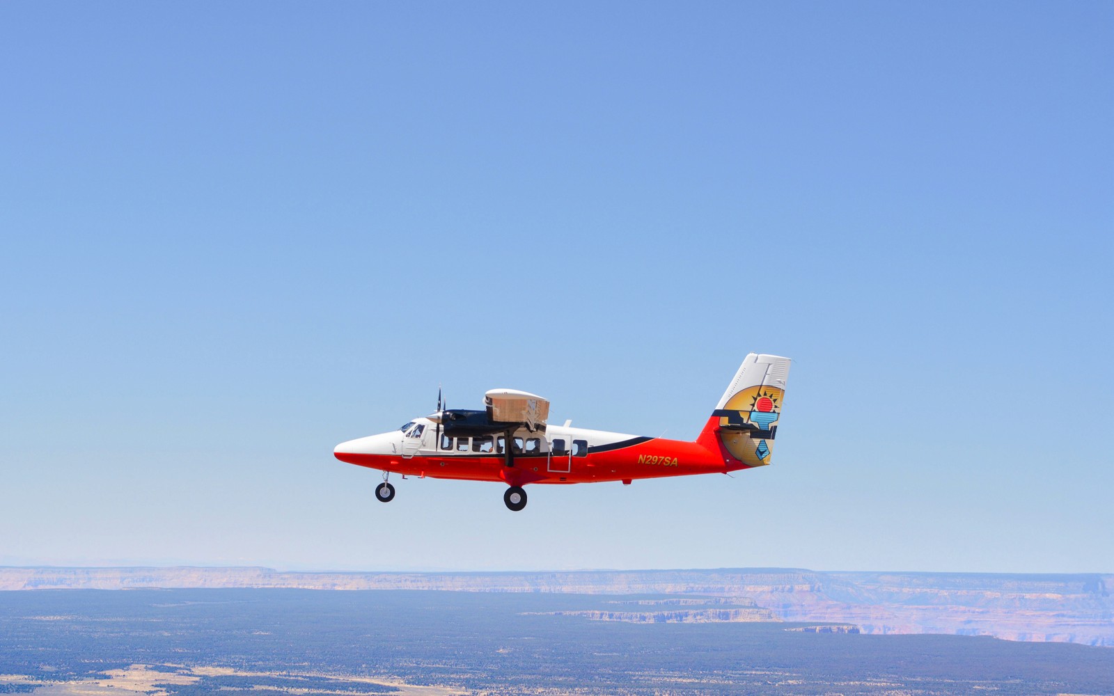 Small plane flying over the Grand Canyon, Arizona.