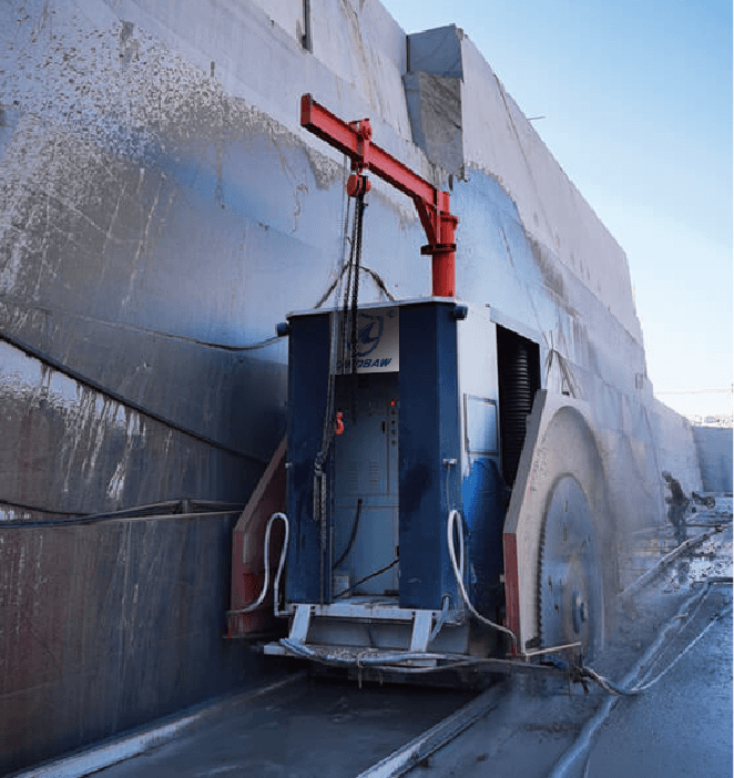 Double Blade Cutter Stone Quarrying Machine cutting through a massive stone wall in a quarry, demonstrating its efficiency and power in handling large-scale stone cutting tasks.