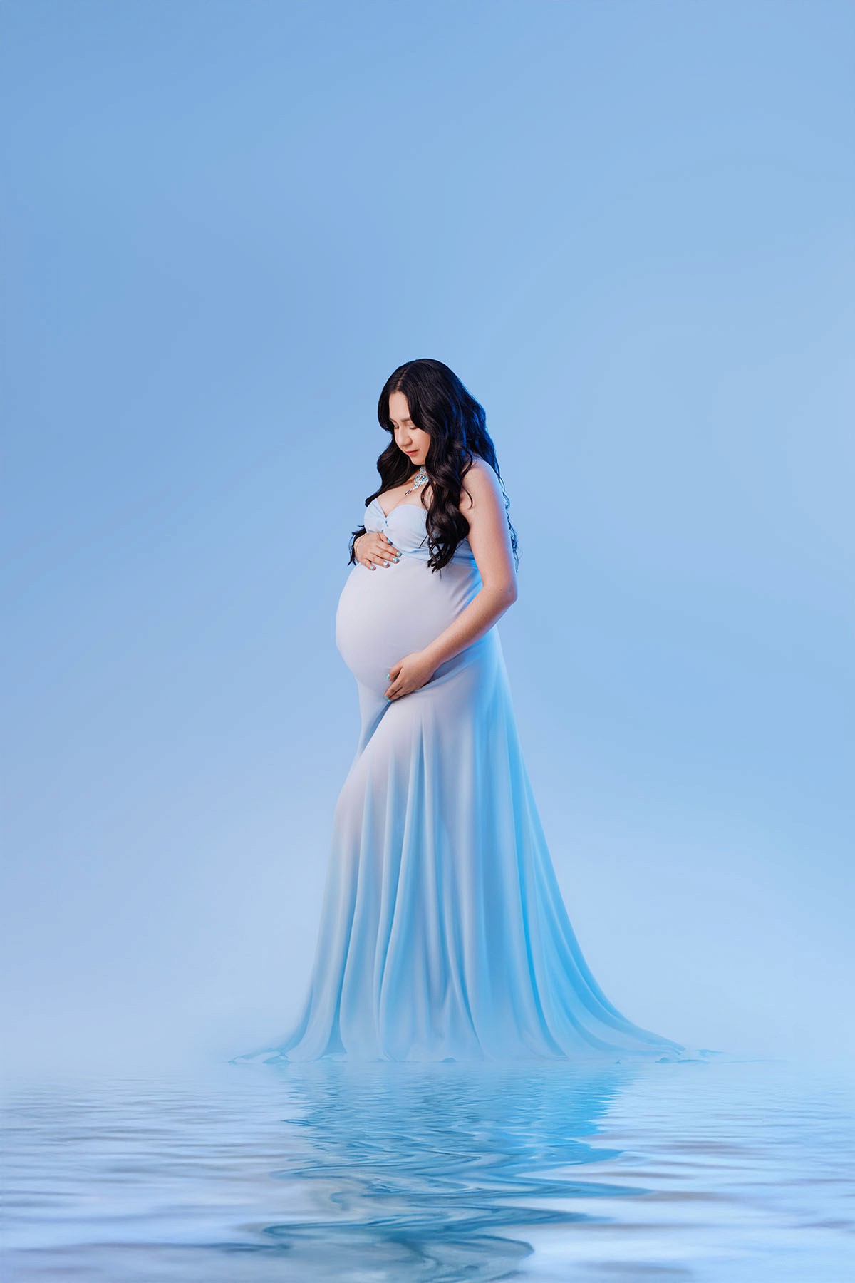 Soft studio lighting and natural posing highlight the beauty of pregnancy — Bloom N’ Baby Studio.