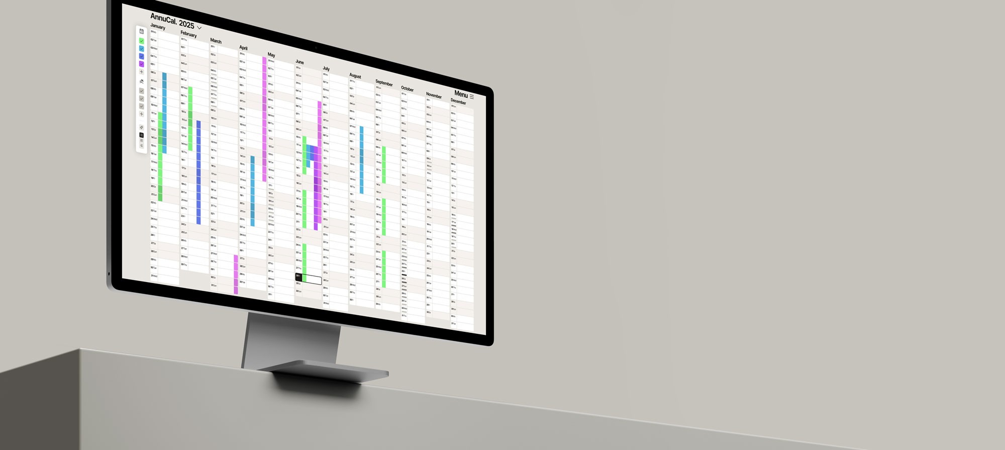 A large screen monitor shows Annucal Yearly Calendar View