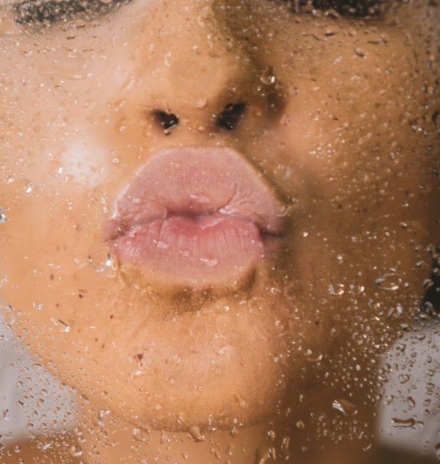 A woman kissing towards the camera