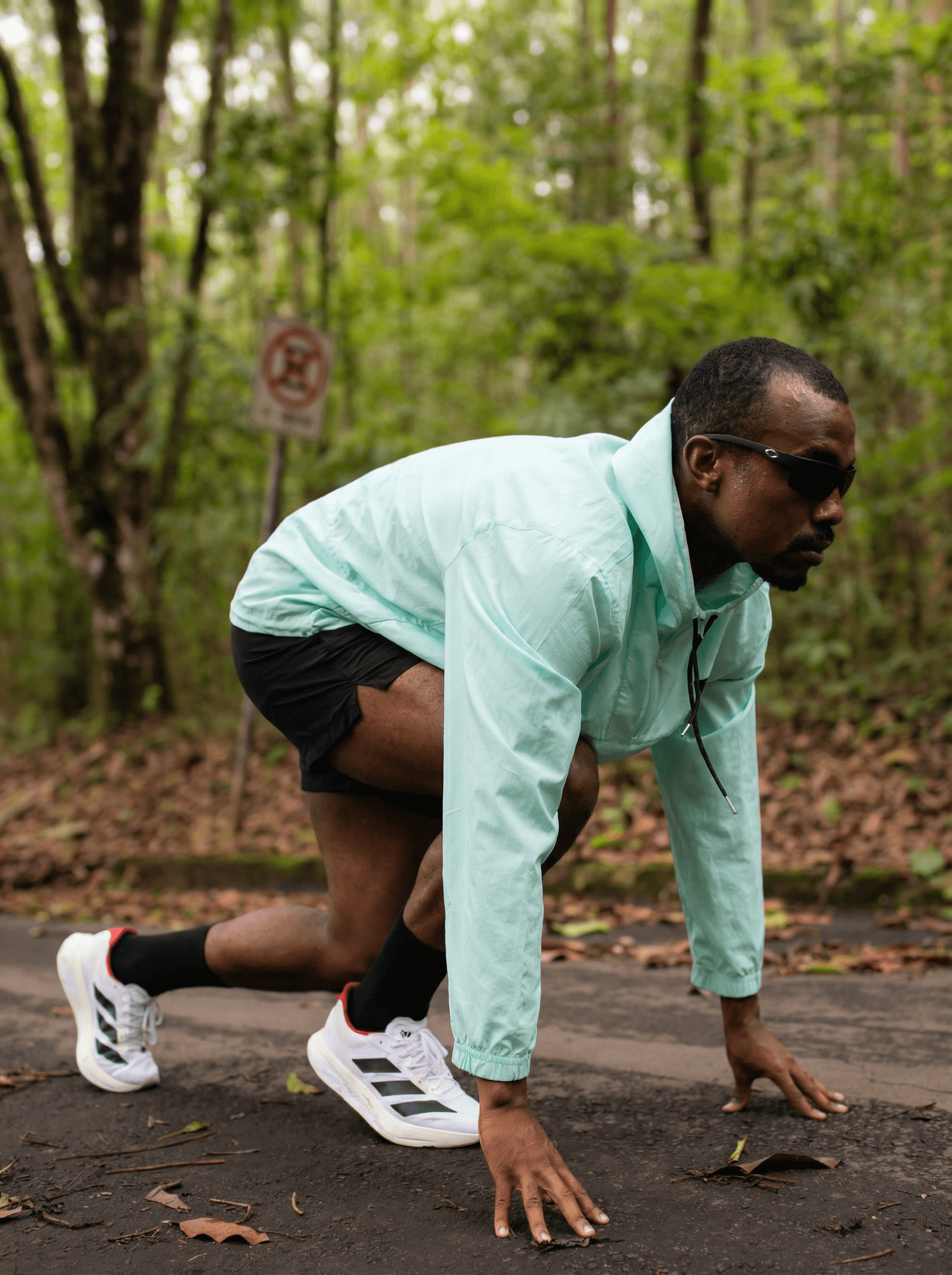 Full moon rising over a dark, silhouetted mountain ridge.