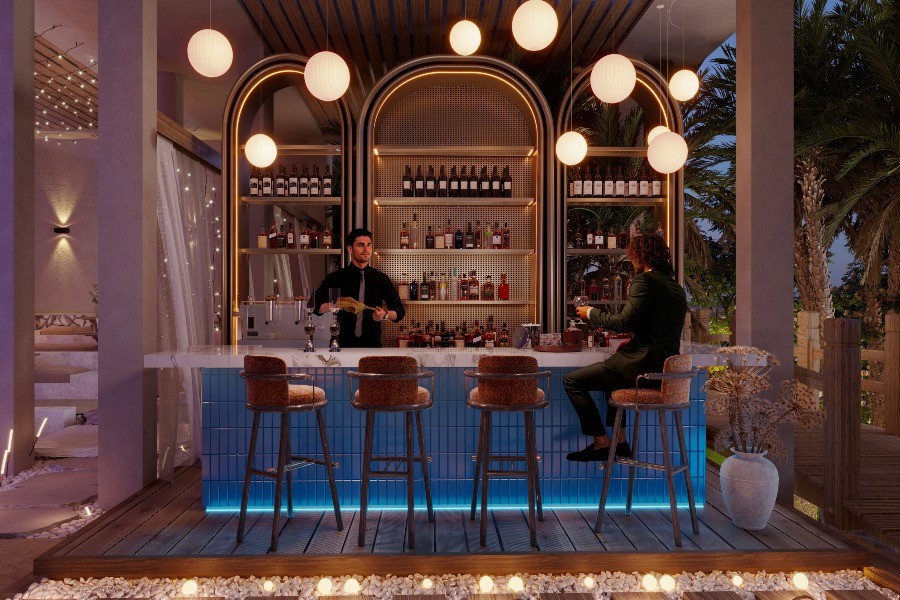 A man and woman are seated at a bar