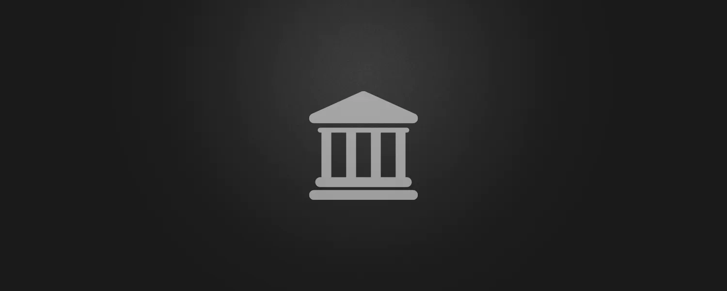 Business account management icon featuring a classical bank or institution building in silver gray on a dark background. Represents Lucas Ostrowski's automated financial systems and professional account management expertise.