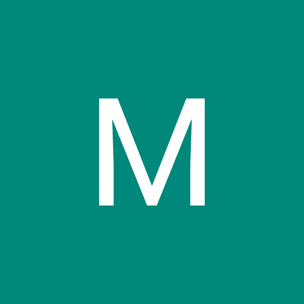 woman in black crew neck t-shirt wearing brown framed eyeglasses standing on rocky shore during